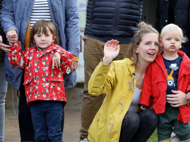 Onlookers, Luca Goulding, 3, Rhiannon Smith ad her son, William, 1. South East Hampshire Young Farmers raising money for the RNLI on their tractor run, in Wickham SquarePicture: Chris Moorhouse (jpns 211023-28)