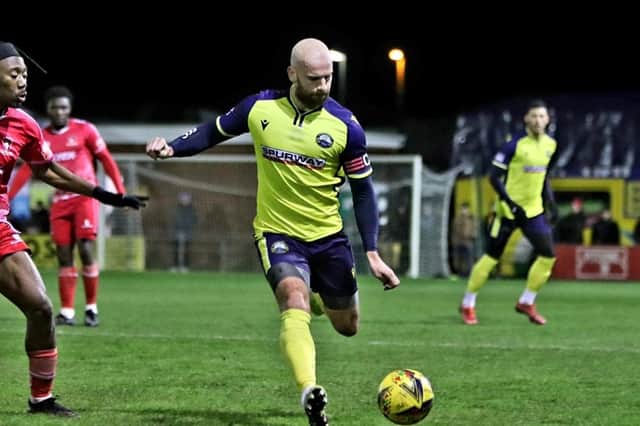 Captain Mike Carter plays a pass in Gosport's defeat against Hayes & Yeading Picture: Tom Phillips