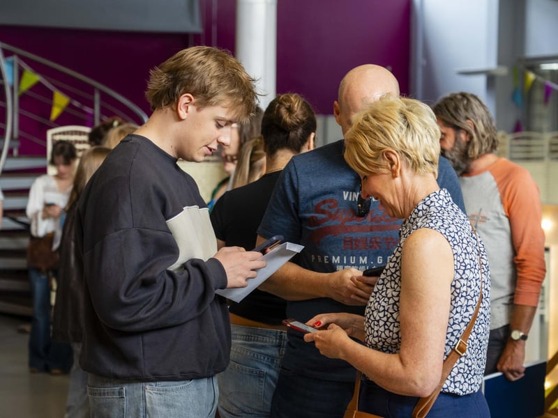 Students and families eagerly spread the news of their results.
