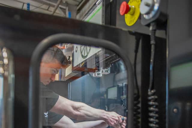 Diamond Cut Refinishing Ltd or DCR manufacture in Portsmouth an alloy wheel refinishing lathe that is then shipped all over the UK and exported now to nearly every continent in the world

Pictured: Evan Crowe operating on a DCR machine at Diamond Cut Finishing, Hilsea, Portsmouth on 23 June 2021

Picture: Habibur Rahman