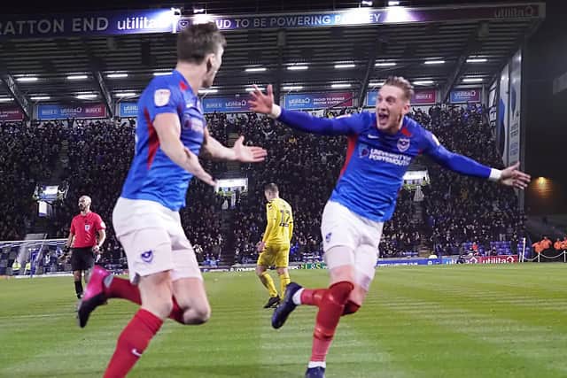 Sean Raggett celebrates his goal with Ronan Curtis after scoring in the March 2-2 draw with Fleetwood - Pompey's last match. Picture: Barry Zee