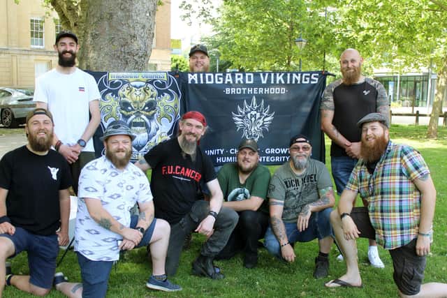 Bristol meet group photo with flag