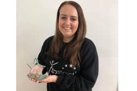 Abstract Dance and Performing Arts was given an international award. Pictured: Principal Amber Leigh Mitchell with this year's trophy