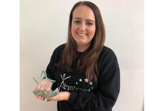 Abstract Dance and Performing Arts was given an international award. Pictured: Principal Amber Leigh Mitchell with this year's trophy