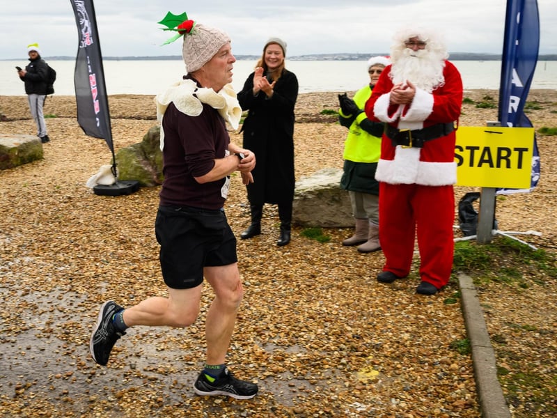 Councillor Zoe Huggins and Santa applauded runners across the line at the Christmas Pud 5k, Stokes Bay, Gosport