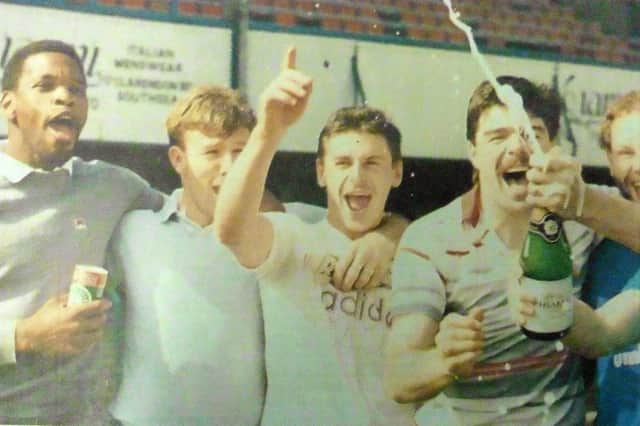 Kevin Ball (second left) joins Pompey team-mates Noel Blake, Mick Kennedy, Mick Quinn, physio John Dickens and Kevin O’Callaghan celebrating promotion to the First Division in May 1987