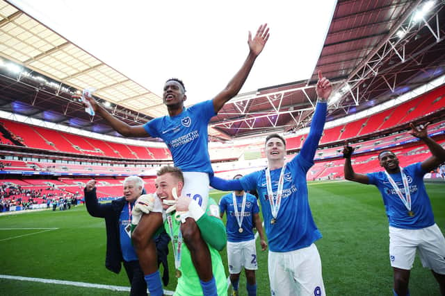 Pompey's players celebrate with supporters after capturing the Checkatrade Trophy in March 2019. Picture: PinPep Media/Joe Pepler