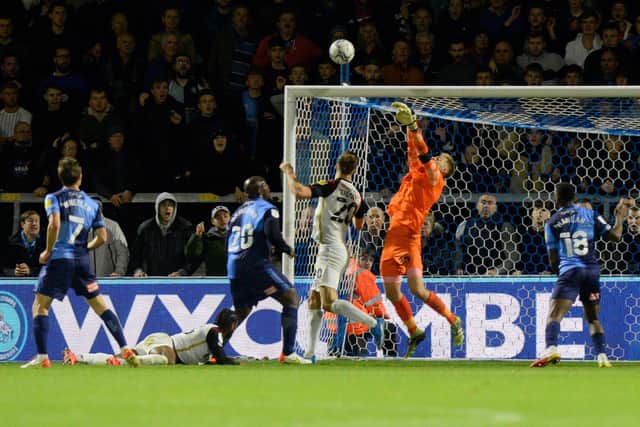 Alex Bass makes another late stop to thwart Wycombe as Pompey held on to triumph 1-0 at Adams Park. Picture: Graham Hunt/ProSportsImages