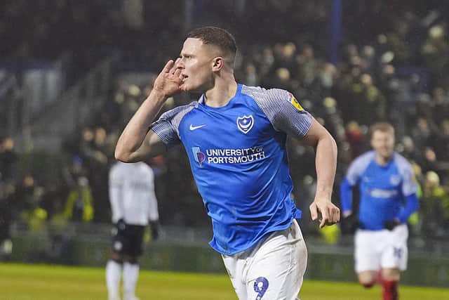 Colby Bishop cupped his ear to the crowd and also put his fingers to his lips after netting Pompey's third against Bolton on Tuesday night. Picture: Barry Zee