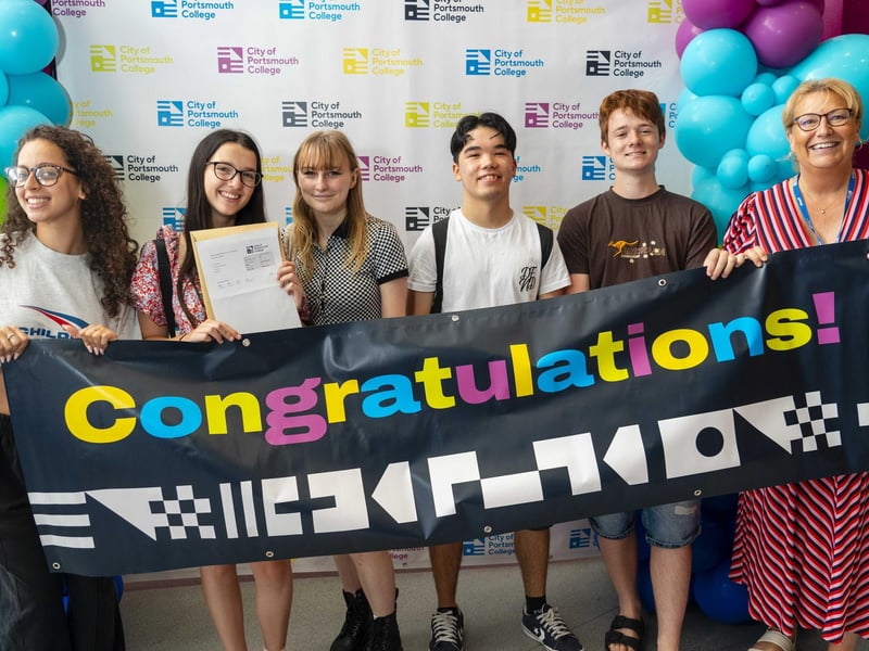 Students celebrate their results at City of Portsmouth College results day 2024.