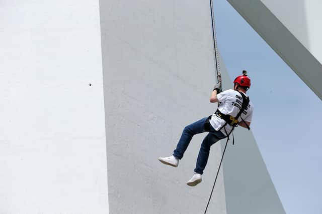 Andrew Fairley abseils down the Spinnaker Tower. Picture: Chris Moorhouse (jpns 100721-11)