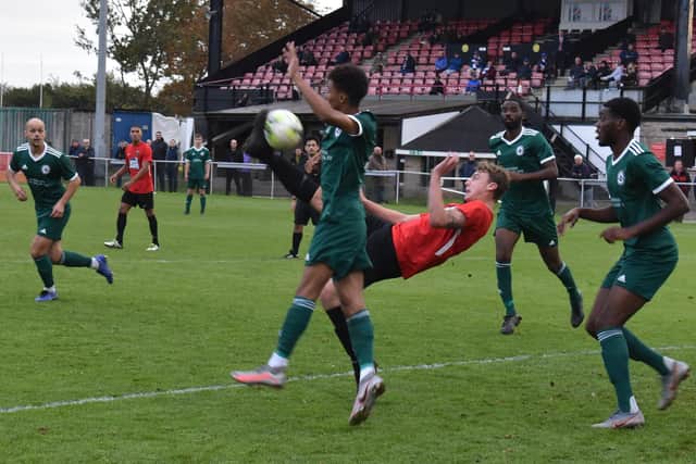 Archie Wilcox acrobatically scores Fareham's sixth goal against Brockenhurst. Picture: Paul Proctor.