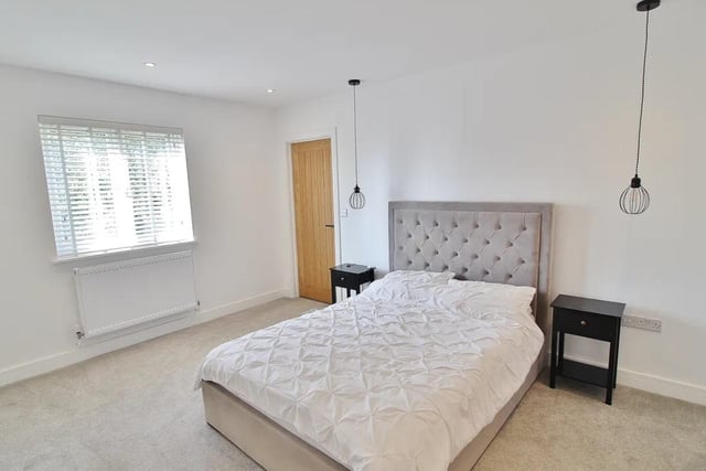 This property comes with 2 dressing rooms, a utility room and a huge open-plan kitchen.