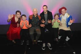 Wayne Sleep, third left, and Portsmouth FC player Christian Burgess, third right, with some of Hayling Musical Society, from left, Kate Backaller, 30, George Porter, five, Phoebe Perry , six, and Paul Goldthorpe, 30 
Picture: Sarah Standing (200220-8283)