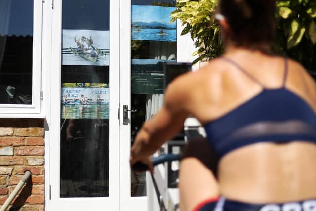 Rebecca Muzerie pinned up motivational pictures on glass doors to help her during training at home during the first national lockdown in May 2020. Photo by Naomi Baker/Getty Images.
