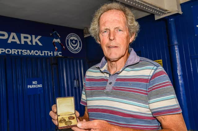 Pompey History Society Acquisitions Officer Mick Hall with the medals of Peter Harris, James Hogg and James Armstrong the society has recently acquired.  Picture: Colin Farmery
