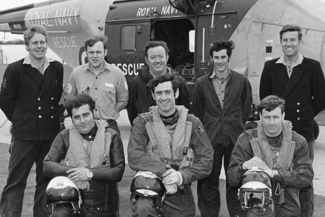 The search and rescue flight crew based at HMS Daedalus pose for a photo in front of their Whirlwind 9 helicopter, undated PP3046