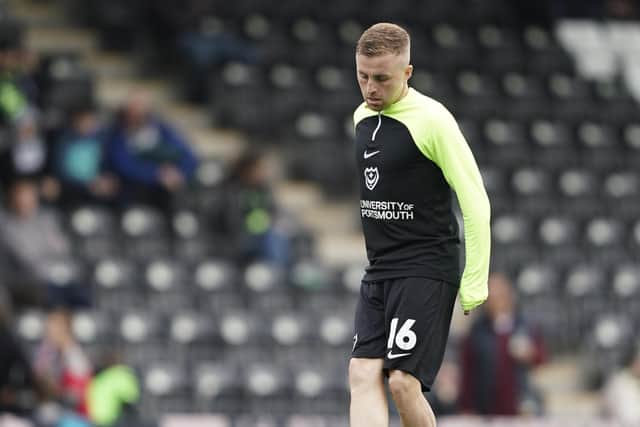 Joe Morrell warms up for Saturday's League One fixture against Forest Green