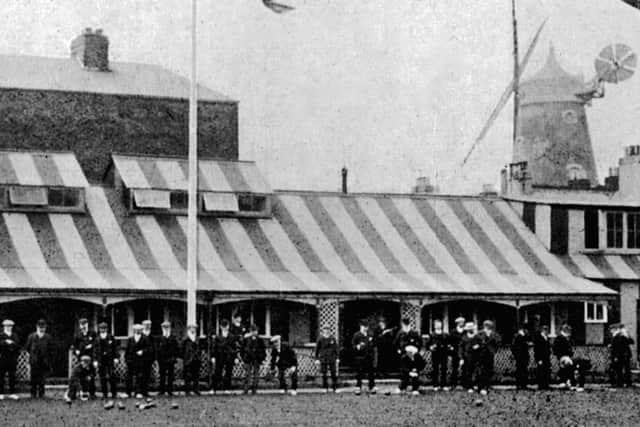 Members of the Saxe-Weimar (now Waverley Road) Bowling Club in 1913 with the windmill overshadowing everything.