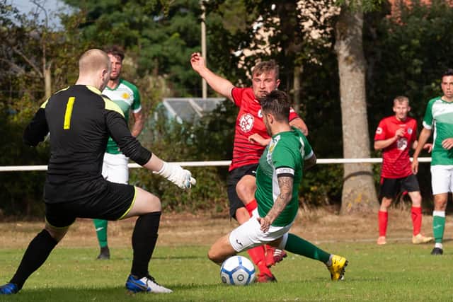 Ryan Bath (red) has scored 15 league and cup goals in as many appearances for Locks Heath this season
Picture: Keith Woodland