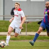 Horndean's Zack Willett, left scored a hat-trick in a 3-1 win a Stoneham in January 2022 - the Purples have not lost at home in the Wessex League since. Picture: Keith Woodland