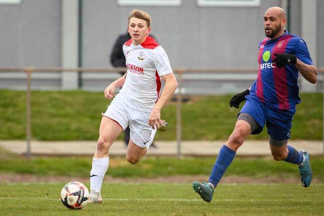 Horndean's Zack Willett, left scored a hat-trick in a 3-1 win a Stoneham in January 2022 - the Purples have not lost at home in the Wessex League since. Picture: Keith Woodland