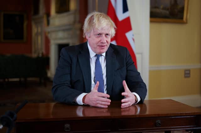Prime Minister Boris Johnson addresses the public to provide an update on the Covid-19 booster programme, at Downing Street on December 12, 2021. Photo by Kirsty O'Connor - WPA Pool/Getty Images