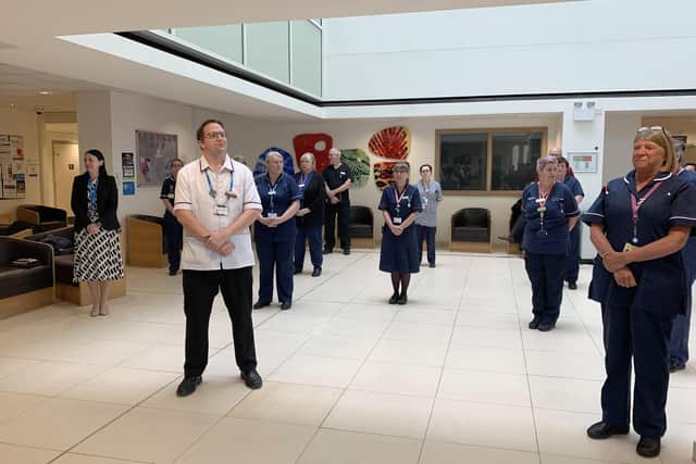 QA staff observing a one minute silence for workers who have died with Covid-19.Picture: Queen Alexandra Hospital  