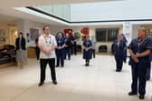 QA staff observing a one minute silence for workers who have died with Covid-19.Picture: Queen Alexandra Hospital  