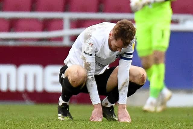 Pompey skipper Tom Naylor is dejected at the final whistle following Pompey's abject 4-1 defeat at struggling Northampton. Picture: Dennis Goodwin/ProSportsImages