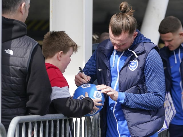 Midfielder Ryan Tunnicliffe signs this young fan's Pompey football
