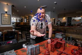 Dice reopened in Albert Road, Southsea, on May 18, 2021. Co-owner, Lee Purslow playing Warhammer 40,000. Picture: Habibur Rahman