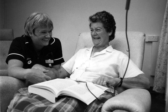 Ward sister Brenda Dillon checks in with leukemia patient Daphne Cuff September 1995