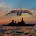 HMS Dragon's Mk8 Lynx Helicopter conducted day into night flying. As part of the sortie it fired all of it's countermeasure flares as the sunset over the ship on the 19th Septemember 2013.