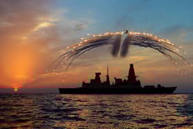 HMS Dragon's Mk8 Lynx Helicopter conducted day into night flying. As part of the sortie it fired all of it's countermeasure flares as the sunset over the ship on the 19th Septemember 2013.