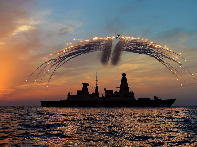 HMS Dragon's Mk8 Lynx Helicopter conducted day into night flying. As part of the sortie it fired all of it's countermeasure flares as the sunset over the ship on the 19th Septemember 2013.