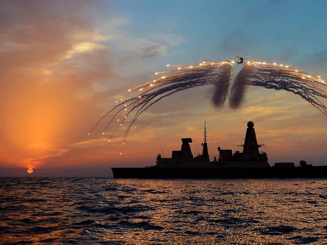 HMS Dragon's Mk8 Lynx Helicopter conducted day into night flying. As part of the sortie it fired all of it's countermeasure flares as the sunset over the ship on the 19th Septemember 2013.