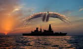 HMS Dragon's Mk8 Lynx Helicopter conducted day into night flying. As part of the sortie it fired all of it's countermeasure flares as the sunset over the ship on the 19th Septemember 2013.