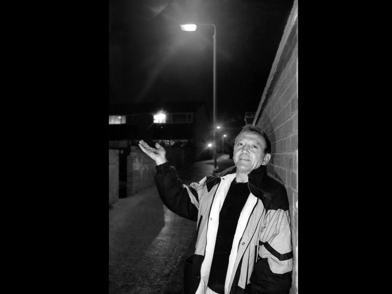 Delighted Peter Carter (52) of Park Walk, Fareham, in the alleyway where lighting has now been restored, 1995. The News PP5757