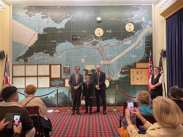 VIP guests Mr Jack Churchill (left) and his son, Alexander Churchill at the D-Day Wall map room at Southwick Park during the first presentation of the historic and priceless wartime artefact on display for the Southwick Revival visitors on Saturday 7 June 2025.   Also in the photograph is Mr Emlyn Taylor (right) Group Managing Director of Lockheed Martin, the Revival’s VIP Headline Sponsor.