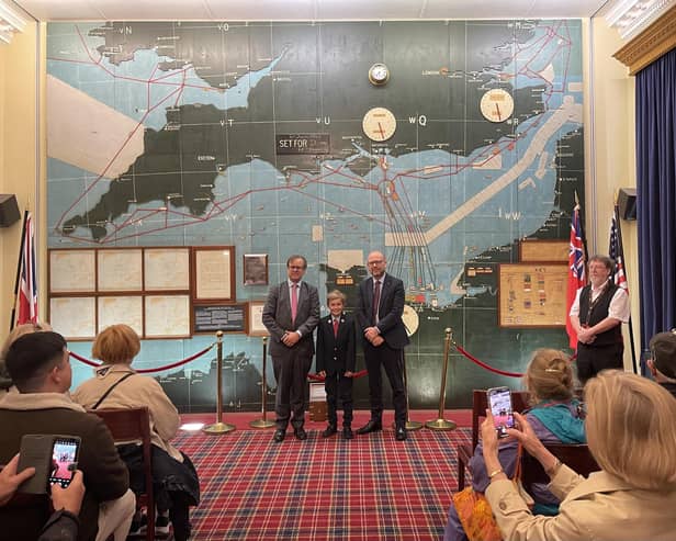 VIP guests Mr Jack Churchill (left) and his son, Alexander Churchill at the D-Day Wall map room at Southwick Park during the first presentation of the historic and priceless wartime artefact on display for the Southwick Revival visitors on Saturday 7 June 2025.   Also in the photograph is Mr Emlyn Taylor (right) Group Managing Director of Lockheed Martin, the Revival’s VIP Headline Sponsor.