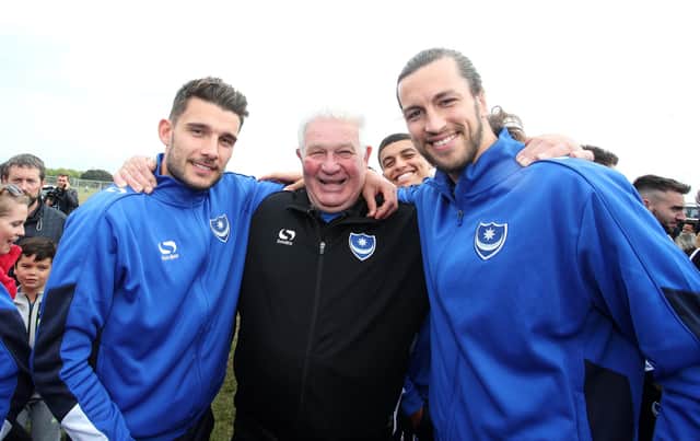 Barry Harris, who had been hospitalised with pneumonia, is pictured with Pompey favourites Gareth Evans and Christian Burgess at the League Two title-winning celebrations on Southsea Common. Picture: Joe Pepler