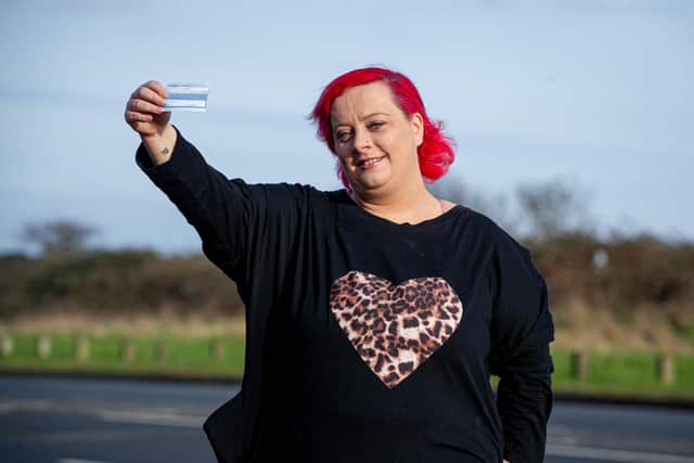 Holli Hart who has learning disabilities had her vaccine jab, pictured near her home in Southsea with a COVID Vaccine Certificate on 15 February 2021
Picture: Habibur Rahman