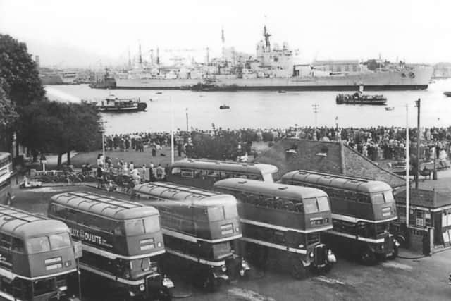 Seen from the Gosport side of Portsmouth Harbour, HMS Vanguard leaves on her final voyage. Picture: Barry Cox collection