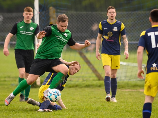Action from Saturn Royale's 1-0 win over Pelham Arms (blue and yellow kit) in the second Adelaide Cup semi-final. Picture: Keith Woodland (300421-554)
