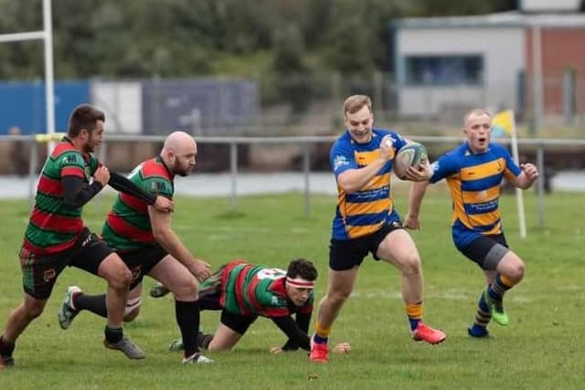 Rob MacKinnon, second right, ran in two tries for Gosport & Fareham against Millbrook. Picture: Martin Burnett