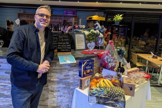 Gary Parker with donated raffle prizes
