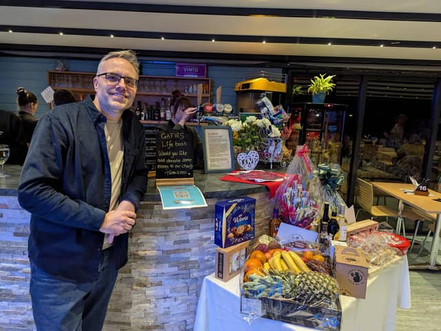 Gary Parker with donated raffle prizes