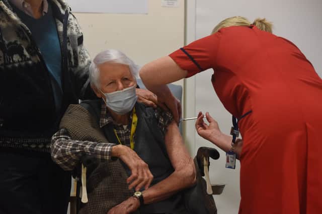 Michael Tibbs, 99, becomes the first patient to receive the Covid vaccine from Chief Nurse Liz Rix.


© Ewan Galvin/Solent News & Photo Agency