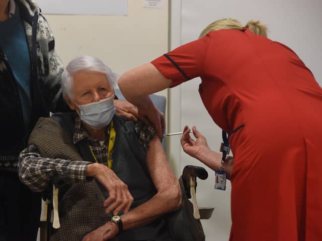 Michael Tibbs, 99, becomes the first patient to receive the Covid vaccine from Chief Nurse Liz Rix.


© Ewan Galvin/Solent News & Photo Agency